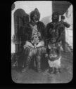 Image of Two Inuit women, boy aboard. Crewman beyond